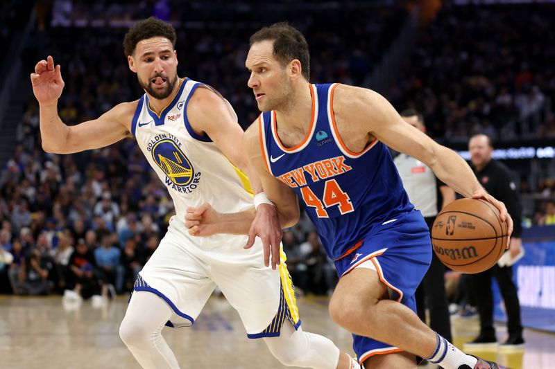 SAN FRANCISCO, CALIFORNIA - MARCH 18: Bojan Bogdanovic #44 of the New York Knicks is guarded by Klay Thompson #11 of the Golden State Warriors in the first half at Chase Center on March 18, 2024 in San Francisco, California. NOTE TO USER: User expressly acknowledges and agrees that, by downloading and or using this photograph, User is consenting to the terms and conditions of the Getty Images License Agreement.  (Photo by Ezra Shaw/Getty Images)