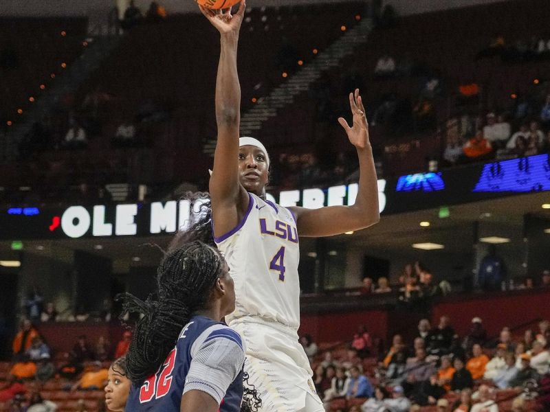 Mar 9, 2024; Greensville, SC, USA; LSU Lady Tigers guard Flau'jae Johnson (4) shoots over Ole Miss Rebels center Rita Igbokwe (32) during the second half at Bon Secours Wellness Arena. Mandatory Credit: Jim Dedmon-USA TODAY Sports