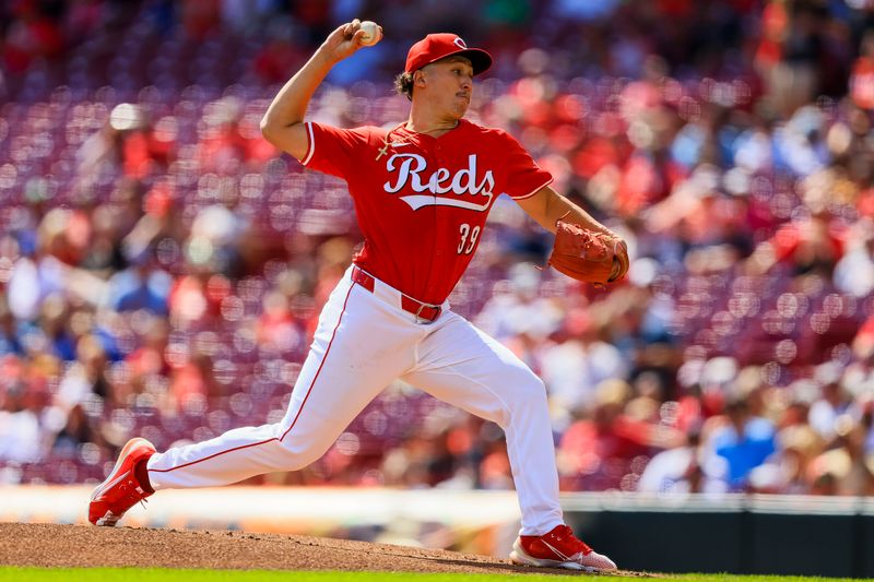 Sep 19, 2024; Cincinnati, Ohio, USA; Cincinnati Reds starting pitcher Julian Aguiar (39) pitches against the Atlanta Braves in the first inning at Great American Ball Park. Mandatory Credit: Katie Stratman-Imagn Images