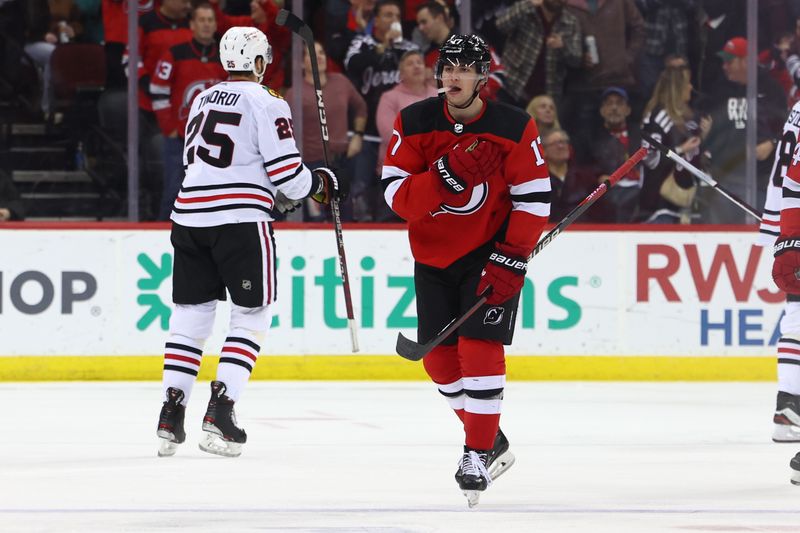 Jan 5, 2024; Newark, New Jersey, USA; New Jersey Devils defenseman Simon Nemec (17) celebrates his goal against the Chicago Blackhawks during the third period at Prudential Center. Mandatory Credit: Ed Mulholland-USA TODAY Sports