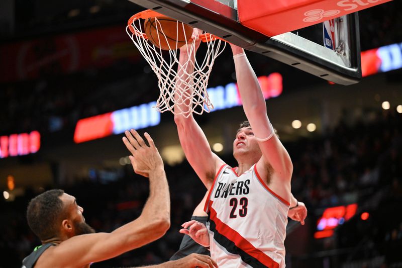 PORTLAND, OREGON - NOVEMBER 13: Donovan Clingan #23 of the Portland Trail Blazers dunks during the third quarter of the game against the Minnesota Timberwolves at Moda Center on November 13, 2024 in Portland, Oregon. The Portland Trail Blazers won 106-98. NOTE TO USER: User expressly acknowledges and agrees that, by downloading and or using this photograph, User is consenting to the terms and conditions of the Getty Images License Agreement. (Photo by Alika Jenner/Getty Images)