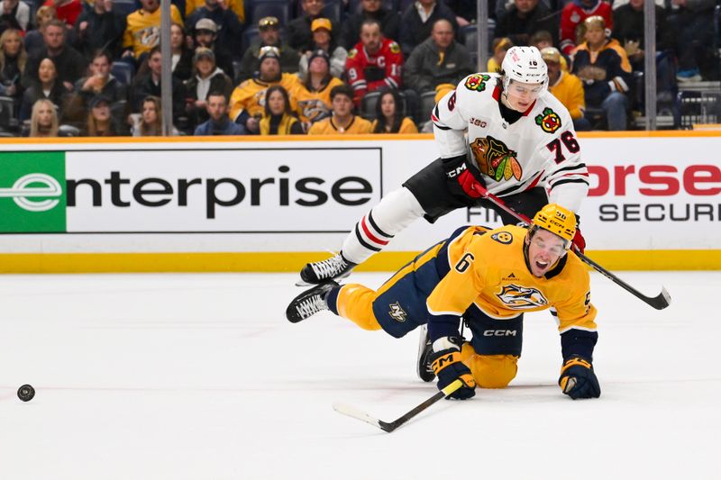 Jan 10, 2026; Nashville, Tennessee, USA;  Chicago Blackhawks left wing Nick Lardis (76) checks Nashville Predators left wing Erik Haula (56) during the first period at Bridgestone Arena. Mandatory Credit: Steve Roberts-Imagn Images