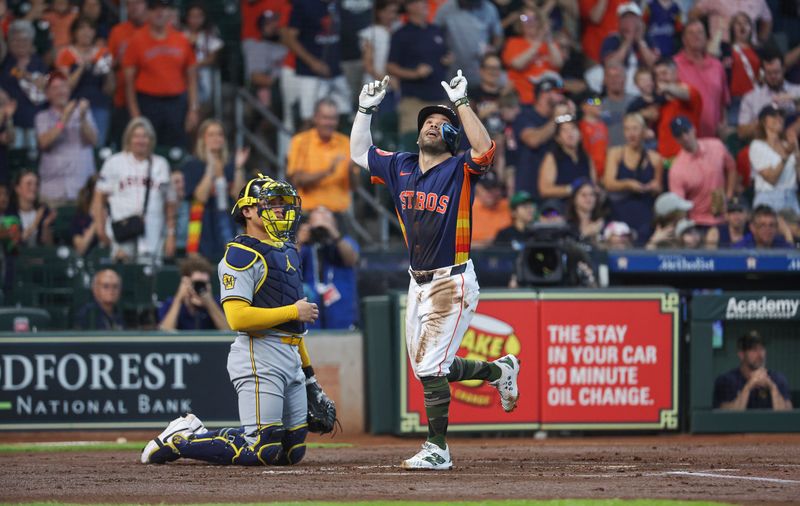 May 19, 2024; Houston, Texas, USA; Houston Astros second baseman Jose Altuve (27) crosses home plate after hitting a home run during the first inning against the Milwaukee Brewers at Minute Maid Park. Mandatory Credit: Troy Taormina-USA TODAY Sports