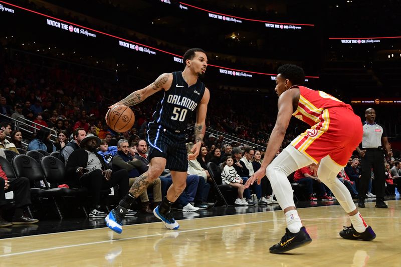 ATLANTA, GA - FEBRUARY 25: Cole Anthony #50 of the Orlando Magic dribbles the ball during the game against the Atlanta Hawks on February 25, 2024 at State Farm Arena in Atlanta, Georgia.  NOTE TO USER: User expressly acknowledges and agrees that, by downloading and/or using this Photograph, user is consenting to the terms and conditions of the Getty Images License Agreement. Mandatory Copyright Notice: Copyright 2024 NBAE (Photo by Scott Cunningham/NBAE via Getty Images)