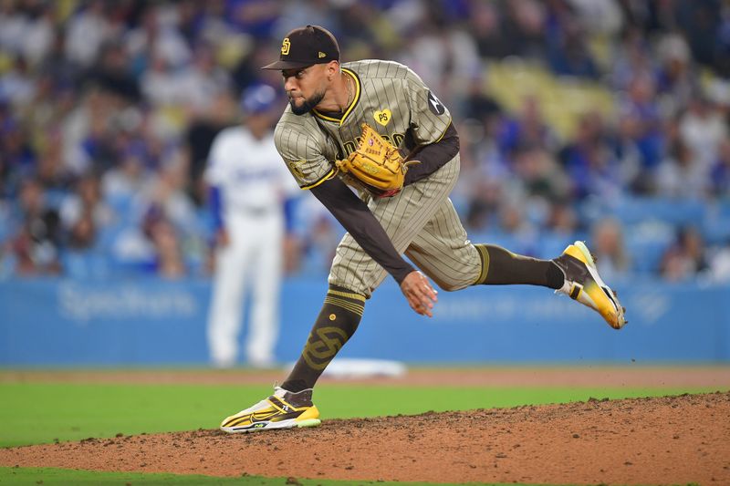 Sep 24, 2024; Los Angeles, California, USA; San Diego Padres pitcher Robert Suarez (75) throws against the Los Angeles Dodgers during the ninth inning at Dodger Stadium. Mandatory Credit: Gary A. Vasquez-Imagn Images