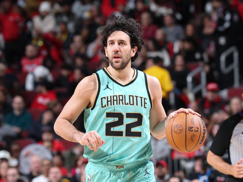 CHICAGO, IL - DECEMBER 13: Vasilije Micic #22 of the Charlotte Hornets  dribbles the ball during the game against the Chicago Bulls on December 13, 2024 at United Center in Chicago, Illinois. NOTE TO USER: User expressly acknowledges and agrees that, by downloading and or using this photograph, User is consenting to the terms and conditions of the Getty Images License Agreement. Mandatory Copyright Notice: Copyright 2024 NBAE (Photo by Jeff Haynes/NBAE via Getty Images)