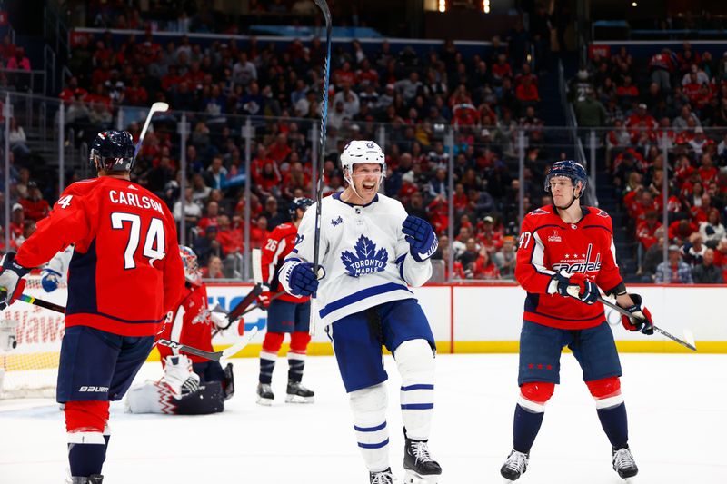 Mar 20, 2024; Washington, District of Columbia, USA; Toronto Maple Leafs defenseman Jake McCabe (22) celebrates after scoring a goal against the Washington Capitals during the second period at Capital One Arena. Mandatory Credit: Amber Searls-USA TODAY Sports