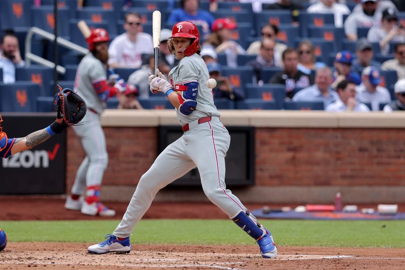 May 14, 2024; New York City, New York, USA; Philadelphia Phillies third baseman Alec Bohm (28) is hit by a pitch with the bases loaded to drive in a run during the third inning against the Philadelphia Phillies at Citi Field. Mandatory Credit: Brad Penner-USA TODAY Sports