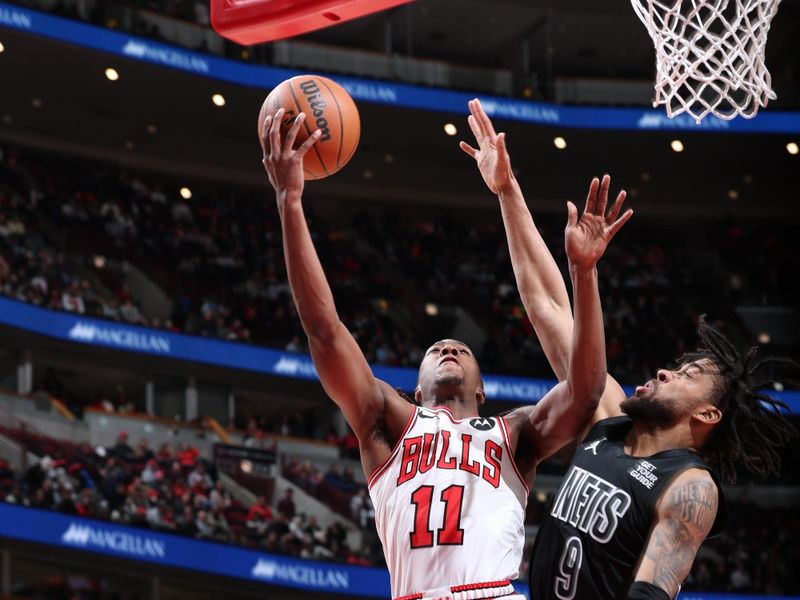 CHICAGO, IL - DECEMBER 2: Ayo Dosunmu #11 of the Chicago Bulls drives to the basket during the game against the Brooklyn Nets on December 2, 2024 at United Center in Chicago, Illinois. NOTE TO USER: User expressly acknowledges and agrees that, by downloading and or using this photograph, User is consenting to the terms and conditions of the Getty Images License Agreement. Mandatory Copyright Notice: Copyright 2024 NBAE (Photo by Jeff Haynes/NBAE via Getty Images)