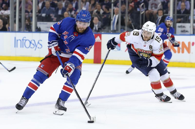 May 22, 2024; New York, New York, USA; New York Rangers center Mika Zibanejad (93) plays the puck against Florida Panthers left wing Matthew Tkachuk (19) during the third period of game one of the Eastern Conference Final of the 2024 Stanley Cup Playoffs at Madison Square Garden. Mandatory Credit: Brad Penner-USA TODAY Sports