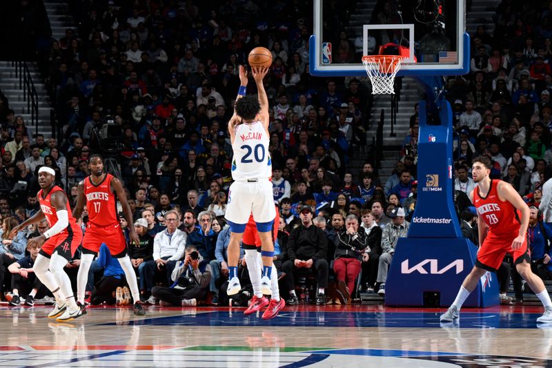 PHILADELPHIA, PA - NOVEMBER 27: Jared McCain #20 of the Philadelphia 76ers shoots a three point basket during the game against the Houston Rockets on November 27, 2024 at the Wells Fargo Center in Philadelphia, Pennsylvania NOTE TO USER: User expressly acknowledges and agrees that, by downloading and/or using this Photograph, user is consenting to the terms and conditions of the Getty Images License Agreement. Mandatory Copyright Notice: Copyright 2024 NBAE (Photo by David Dow/NBAE via Getty Images)