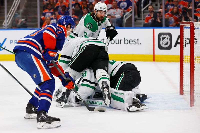 May 29, 2024; Edmonton, Alberta, CAN;Edmonton Oilers forward Ryan McLeod (71) slides a puck past Dallas Stars goaltender Jake Oettinger (29) to score a goal during the first period in game four of the Western Conference Final of the 2024 Stanley Cup Playoffs at Rogers Place. Mandatory Credit: Perry Nelson-USA TODAY Sports