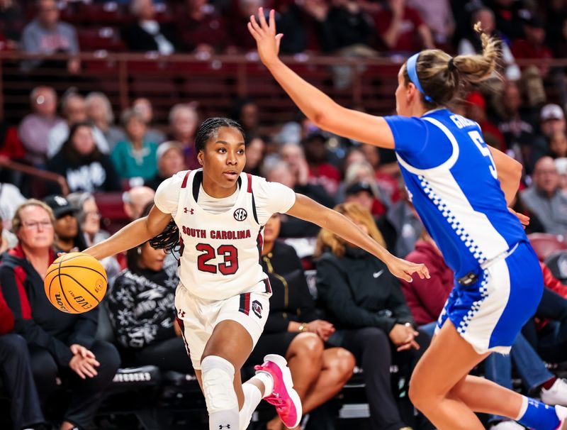 Feb 2, 2023; Columbia, South Carolina, USA; South Carolina Gamecocks guard Bree Hall (23) looks to drive around Kentucky Wildcats guard Blair Green (5) in the first half at Colonial Life Arena. Mandatory Credit: Jeff Blake-USA TODAY Sports