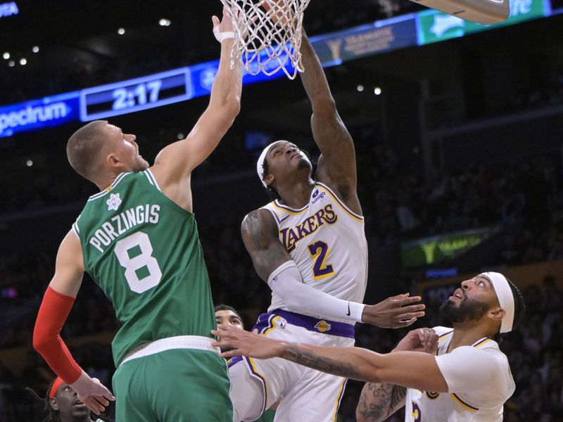 LOS ANGELES, CALIFORNIA - DECEMBER 25: Jarred Vanderbilt #2 of the Los Angeles Lakers shoots over Kristaps Porzingis #8 of the Boston Celtics in the first half at Crypto.com Arena on December 25, 2023 in Los Angeles, California. NOTE TO USER: User expressly acknowledges and agrees that, by downloading and or using this photograph, User is consenting to the terms and conditions of the Getty Images License Agreement.(Photo by Jayne Kamin-Oncea/Getty Images)