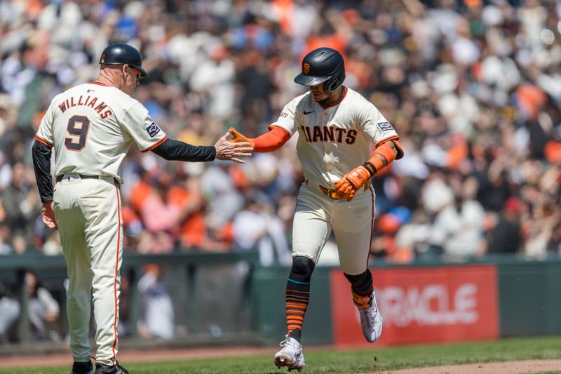 Apr 28, 2024; San Francisco, California, USA;  San Francisco Giants second baseman Thairo Estrada (39) is congratulated by third base coach Matt Williams (9) after hitting a solo home run against the Pittsburgh Pirates during the third inning at Oracle Park. Mandatory Credit: John Hefti-USA TODAY Sports