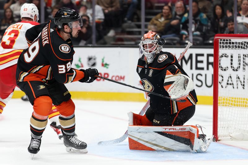 Dec 21, 2023; Anaheim, California, USA;  Anaheim Ducks goaltender Lukas Dostal (1) and center Sam Carrick (39)defends the goal during the first period against the Calgary Flames at Honda Center. Mandatory Credit: Kiyoshi Mio-USA TODAY Sports