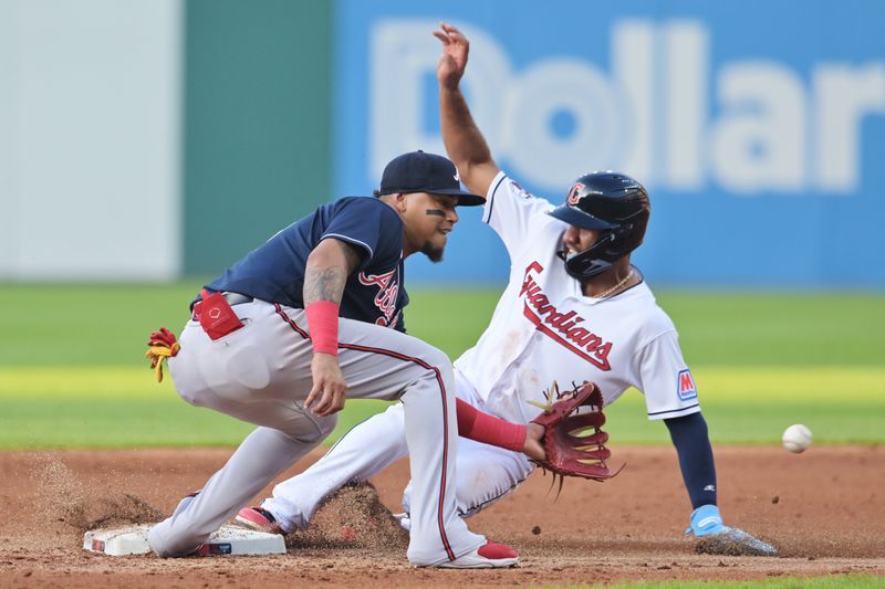 Jul 3, 2023; Cleveland, Ohio, USA; Cleveland Guardians shortstop Amed Rosario (1) steals second as Atlanta Braves shortstop Orlando Arcia (11) waits for the throw during the third inning at Progressive Field. Mandatory Credit: Ken Blaze-USA TODAY Sports