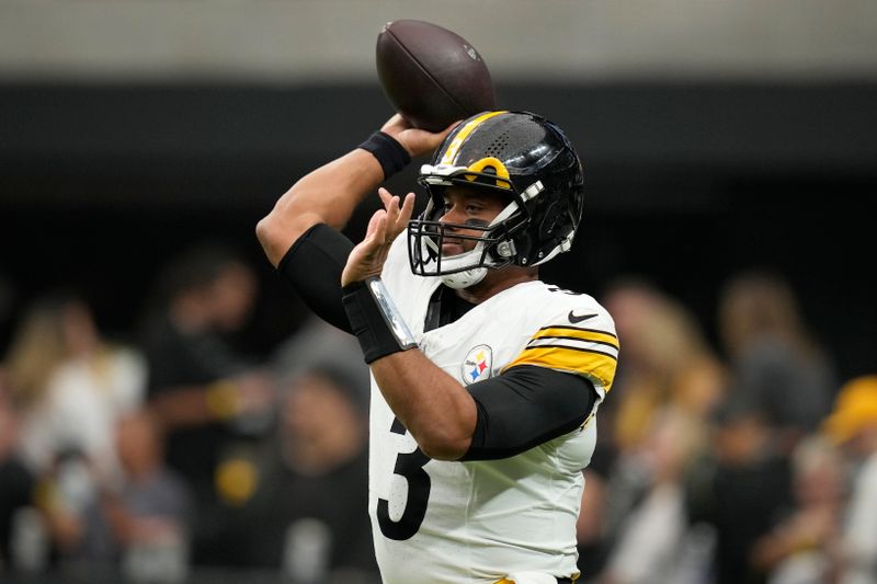 Pittsburgh Steelers quarterback Russell Wilson (3) warms up before an NFL football game against the Las Vegas Raiders in Las Vegas, Sunday, Oct. 13, 2024. (AP Photo/John Locher)