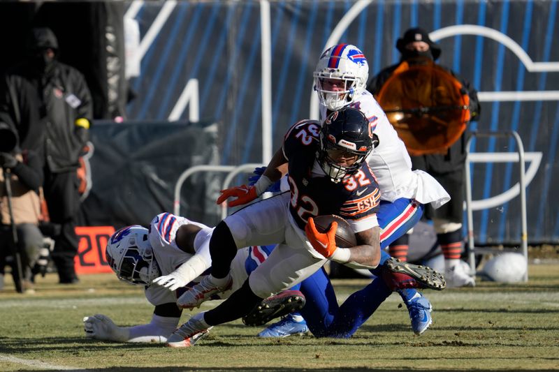 Chicago Bears running back David Montgomery (32) is tackled by Buffalo Bills defensive end Shaq Lawson (90) in the second half of an NFL football game in Chicago, Saturday, Dec. 24, 2022. (AP Photo/Nam Y. Huh)