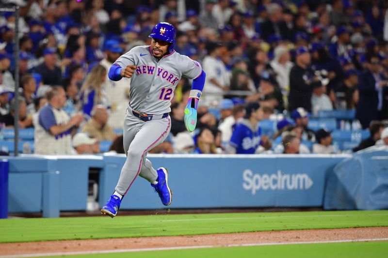 June 3, 2025; Los Angeles, California, USA; New York Mets shortstop Francisco Lindor (12) runs home to score against the Los Angeles Dodgers during the fifth inning at Dodger Stadium. Mandatory Credit: Gary A. Vasquez-Imagn Images