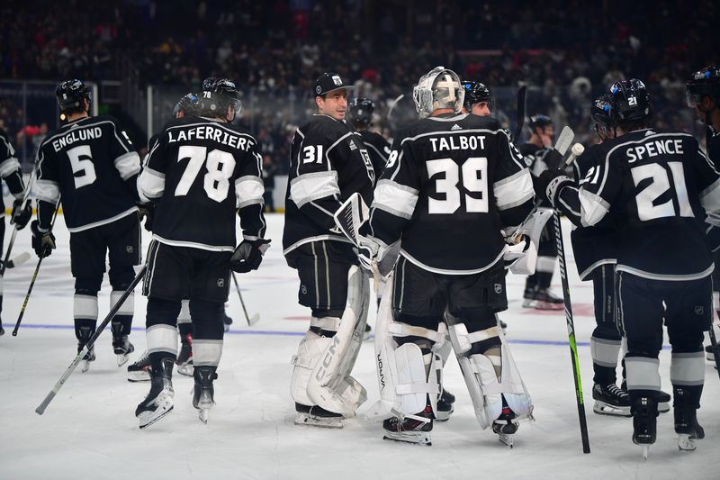 Apr 18, 2024; Los Angeles, California, USA; Los Angeles Kings celebrate the overtime goal scored by right wing Adrian Kempe (9) against the Chicago Blackhawks for the victory at Crypto.com Arena. Mandatory Credit: Gary A. Vasquez-USA TODAY Sports