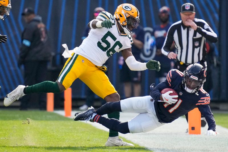 Green Bay Packers' Edgerrin Cooper stops Chicago Bears' DeAndre Carter during the first half of an NFL football game Sunday, Nov. 17, 2024, in Chicago. (AP Photo/Nam Y. Huh)