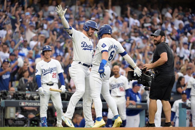 Oct 11, 2024; Los Angeles, California, USA; Los Angeles Dodgers third baseman Enrique Hernandez (8) celebrates with second baseman Gavin Lux (9) zafter hitting a solo home run in the second inning against the San Diego Padres during game five of the NLDS for the 2024 MLB Playoffs at Dodger Stadium. Mandatory Credit: Jayne Kamin-Oncea-Imagn Images