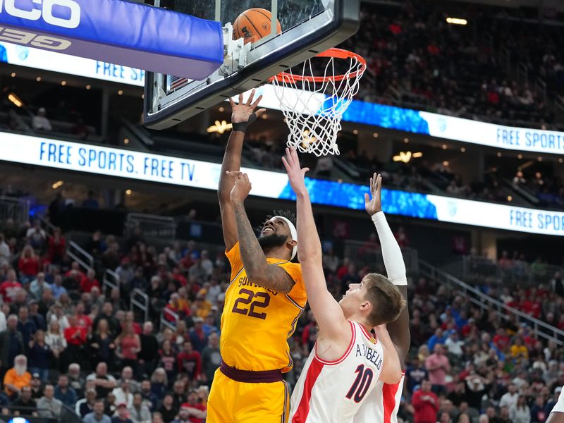 Mar 10, 2023; Las Vegas, NV, USA; Arizona State Sun Devils forward Warren Washington (22) shoots inside the defense of Arizona Wildcats forward Azuolas Tubelis (10) during the first half at T-Mobile Arena. Mandatory Credit: Stephen R. Sylvanie-USA TODAY Sports