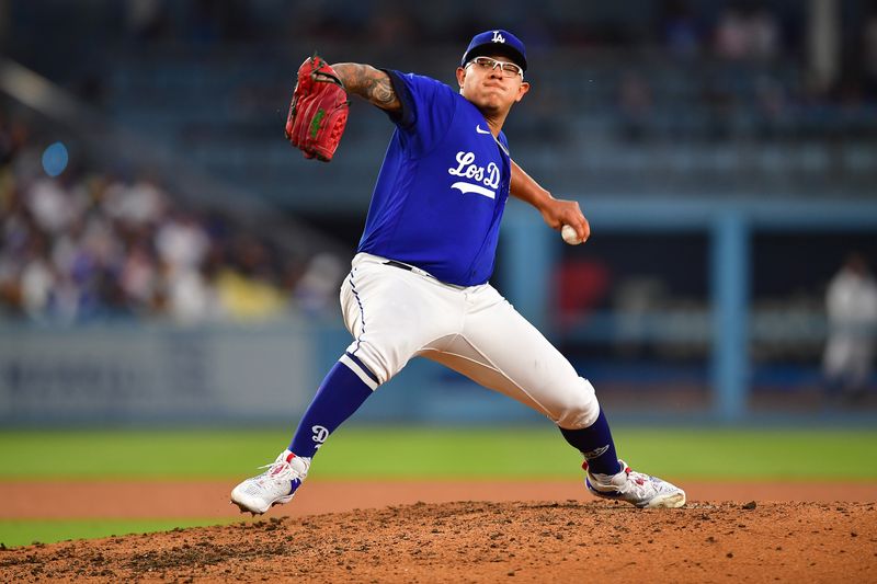Jul 6, 2023; Los Angeles, California, USA; Los Angeles Dodgers starting pitcher Julio Urias (7) throws against the Pittsburgh Pirates during the fifth inning at Dodger Stadium. Mandatory Credit: Gary A. Vasquez-USA TODAY Sports