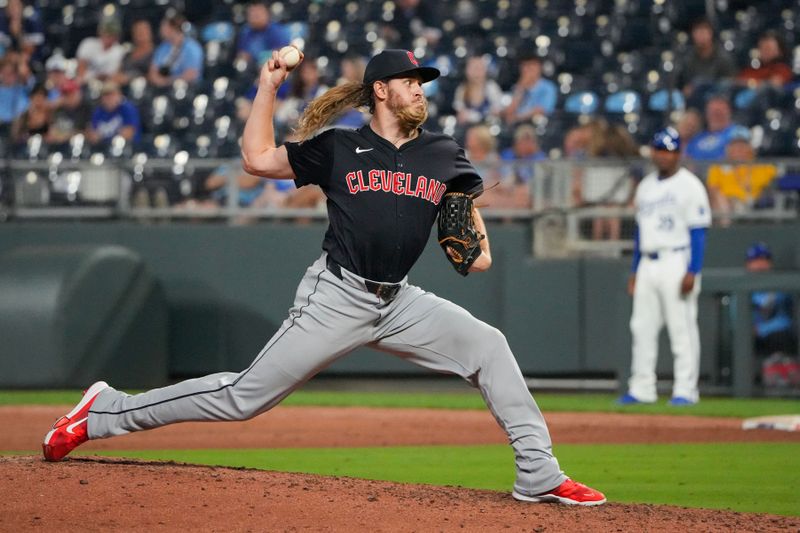 Sep 3, 2024; Kansas City, Missouri, USA; Cleveland Guardians pitcher Scott Barlow (58) delivers a pitch against the Kansas City Royals in the ninth inning at Kauffman Stadium. Mandatory Credit: Denny Medley-Imagn Images