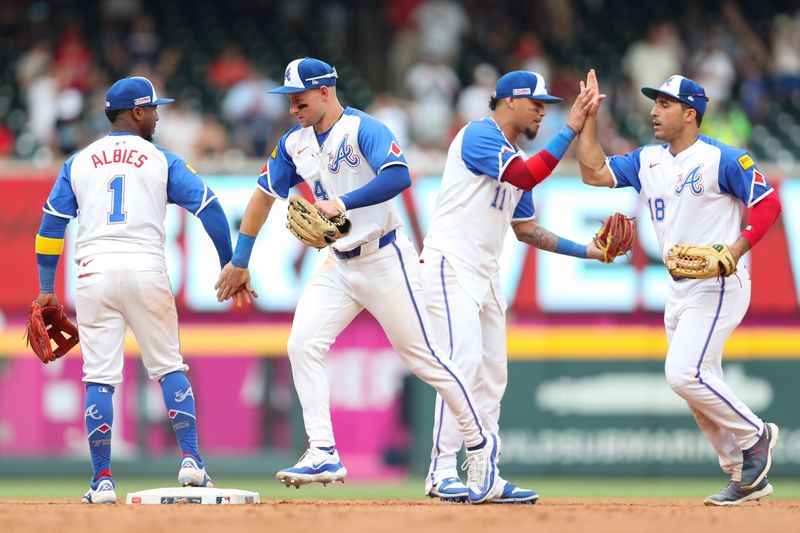 Jun 15, 2024; Cumberland, Georgia, USA; Atlanta Braves teammates celebrate the win against the Tampa Bay Rays at Truist Park. Mandatory Credit: Mady Mertens-USA TODAY Sports