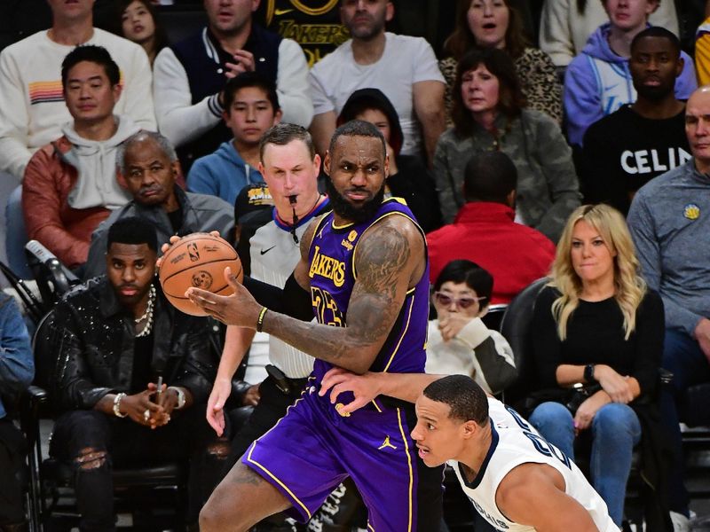 LOS ANGELES, CA - JANUARY 5: LeBron James #23 of the Los Angeles Lakers looks to pass the ball during the game against the Memphis Grizzlies on January 5, 2024 at Crypto.Com Arena in Los Angeles, California. NOTE TO USER: User expressly acknowledges and agrees that, by downloading and/or using this Photograph, user is consenting to the terms and conditions of the Getty Images License Agreement. Mandatory Copyright Notice: Copyright 2024 NBAE (Photo by Adam Pantozzi/NBAE via Getty Images)