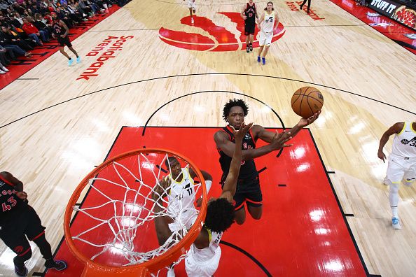 TORONTO, CANADA - DECEMBER 23:  OG Anunoby #3 of the Toronto Raptors drives to the basket during the game against the Utah Jazz on December 23, 2023 at the Scotiabank Arena in Toronto, Ontario, Canada.  NOTE TO USER: User expressly acknowledges and agrees that, by downloading and or using this Photograph, user is consenting to the terms and conditions of the Getty Images License Agreement.  Mandatory Copyright Notice: Copyright 2023 NBAE (Photo by Vaughn Ridley/NBAE via Getty Images)