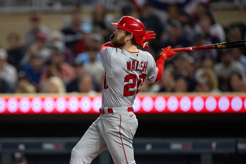 Sep 22, 2023; Minneapolis, Minnesota, USA; Los Angeles Angels right fielder Jared Walsh (20) hits a two run home run during the fifth inning against the Minnesota Twins at Target Field. Mandatory Credit: Jordan Johnson-USA TODAY Sports