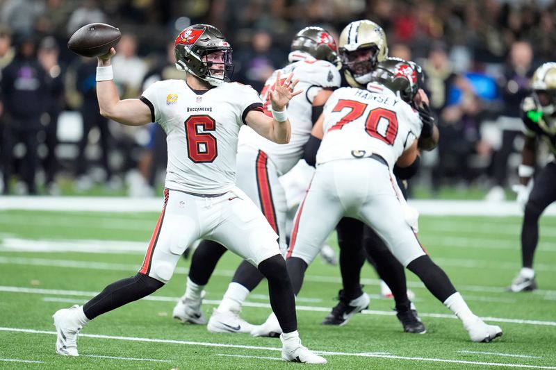 Tampa Bay Buccaneers quarterback Baker Mayfield (6) passes against the New Orleans Saints during the first half of an NFL football game in New Orleans, Sunday, Oct. 13, 2024. (AP Photo/Michael Conroy)