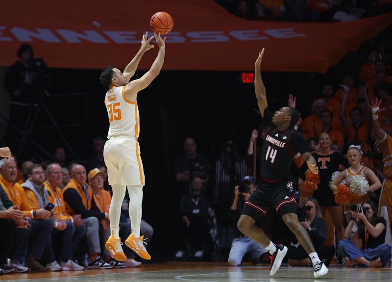 Dec 16, 2025; Knoxville, Tennessee, USA;  Tennessee Volunteers guard Ethan Burg (35) shoots a three  point shot against Louisville Cardinals guard Adrian Wooley (14) during the second half at Thompson-Boling Arena at Food City Center. Mandatory Credit: Randy Sartin-Imagn Images