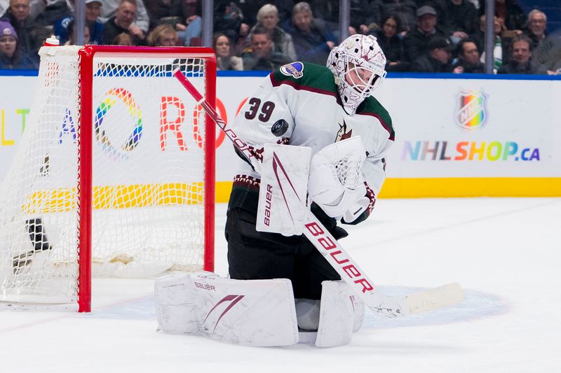 Jan 18, 2024; Vancouver, British Columbia, CAN; Arizona Coyotes goalie Connor Ingram (39) makes a save against the Vancouver Canucks in the third period at Rogers Arena. Vancouver won 2-1. Mandatory Credit: Bob Frid-USA TODAY Sports