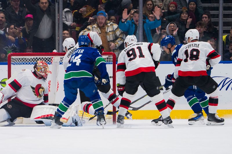 Jan 2, 2024; Vancouver, British Columbia, CAN; Vancouver Canucks forward Elias Pettersson (40) scores on Ottawa Senators goalie Anton Forsberg (31) in the first period at Rogers Arena. Mandatory Credit: Bob Frid-USA TODAY Sports