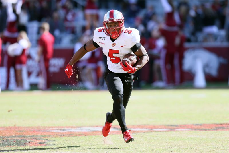 Nov 9, 2019; Fayetteville, AR, USA; Western Kentucky Hilltoppers running back Gaej Walker (5) rushes against the Arkansas Razorbacks at Donald W. Reynolds Razorback Stadium. Western Kentucky won 45-19. Mandatory Credit: Nelson Chenault-USA TODAY Sports