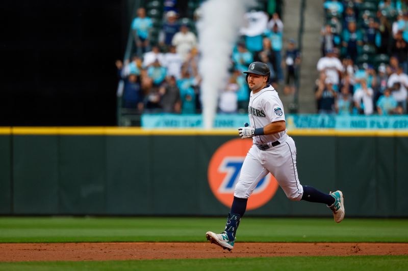 Jun 13, 2023; Seattle, Washington, USA; Seattle Mariners catcher Cal Raleigh (29) runs the bases after hitting a three-run home run against the Miami Marlins during the second inning at T-Mobile Park. Mandatory Credit: Joe Nicholson-USA TODAY Sports