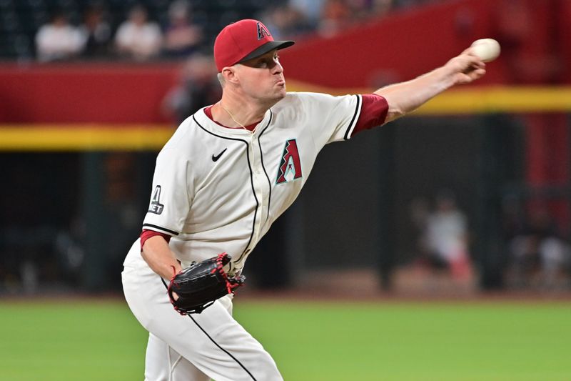 Jun 27, 2024; Phoenix, Arizona, USA; Arizona Diamondbacks pitcher Joe Mantiply (35) throws in the ninth inning against the Minnesota Twins at Chase Field. Mandatory Credit: Matt Kartozian-USA TODAY Sports