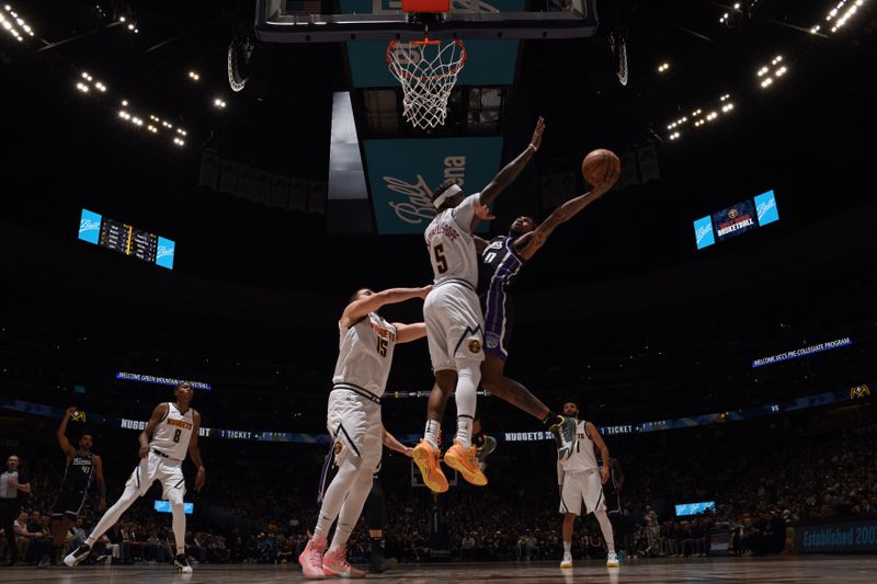 DENVER, CO - FEBRUARY 28: Malik Monk #0 of the Sacramento Kings drives to the basket during the game against the Denver Nuggets on February 28, 2024 at the Ball Arena in Denver, Colorado. NOTE TO USER: User expressly acknowledges and agrees that, by downloading and/or using this Photograph, user is consenting to the terms and conditions of the Getty Images License Agreement. Mandatory Copyright Notice: Copyright 2024 NBAE (Photo by Garrett Ellwood/NBAE via Getty Images)