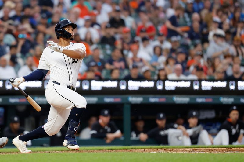 Jun 24, 2025; Detroit, Michigan, USA; Detroit Tigers outfielder Wenceel Perez (46) hits a double in the third inning against the Athletics at Comerica Park. Mandatory Credit: Rick Osentoski-Imagn Images