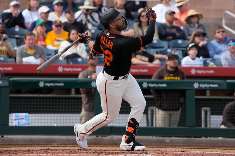 Feb 28, 2023; Scottsdale, Arizona, USA; San Francisco Giants third baseman David Villar (32) hits against the San Diego Padres in the second inning at Scottsdale Stadium. Mandatory Credit: Rick Scuteri-USA TODAY Sports