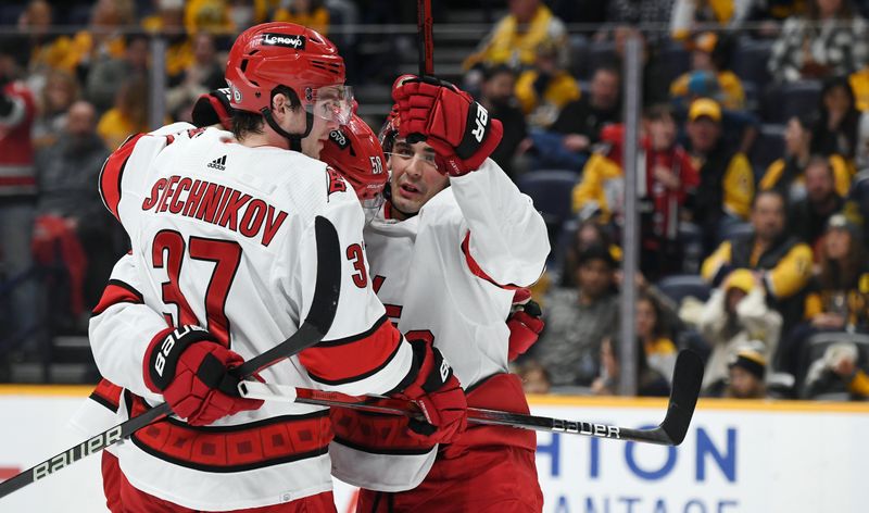 Dec 27, 2023; Nashville, Tennessee, USA; Carolina Hurricanes center Seth Jarvis (24) celebrates after scoring during the second period against the Nashville Predators at Bridgestone Arena. Mandatory Credit: Christopher Hanewinckel-USA TODAY Sports