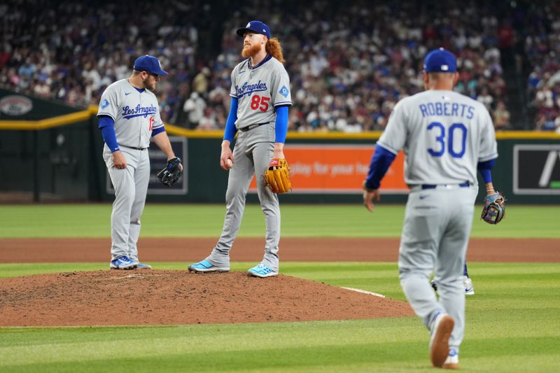 May 10, 2025; Phoenix, Arizona, USA; Los Angeles Dodgers pitcher Dustin May (85) is taken out of the game against the Arizona Diamondbacks during the seventh inning at Chase Field. Mandatory Credit: Joe Camporeale-Imagn Images