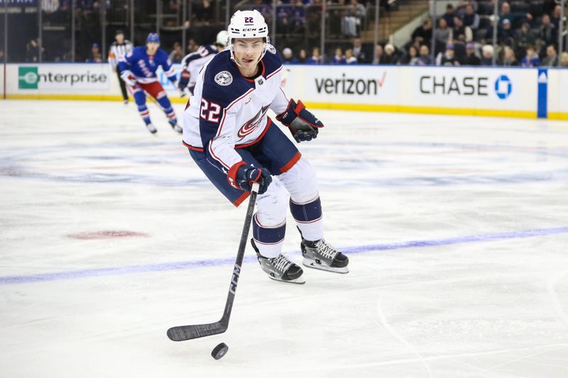 Nov 12, 2023; New York, New York, USA;  Columbus Blue Jackets defenseman Jake Bean (22) controls the puck in the first period against the New York Rangers at Madison Square Garden. Mandatory Credit: Wendell Cruz-USA TODAY Sports