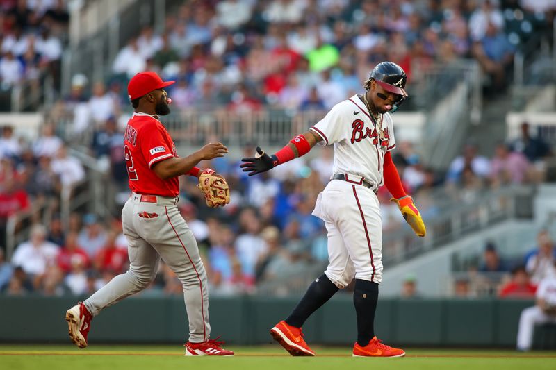 Aug 1, 2023; Atlanta, Georgia, USA; Los Angeles Angels second baseman Luis Rengifo (2) tags out Atlanta Braves right fielder Ronald Acuna Jr. (13) in the first inning at Truist Park. Mandatory Credit: Brett Davis-USA TODAY Sports