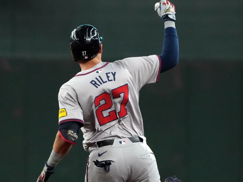 Jul 8, 2024; Phoenix, Arizona, USA; Atlanta Braves third baseman Austin Riley (27) reacts after hitting a solo home run against the Arizona Diamondbacks in the first inning at Chase Field. Mandatory Credit: Rick Scuteri-USA TODAY Sports