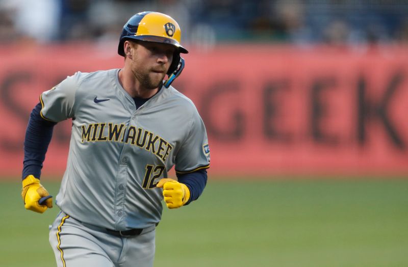 Apr 22, 2024; Pittsburgh, Pennsylvania, USA;  Milwaukee Brewers designated hitter Rhys Hoskins (12) circles the bases on a solo home run against the Pittsburgh Pirates during the fifth inning at PNC Park. Mandatory Credit: Charles LeClaire-USA TODAY Sports